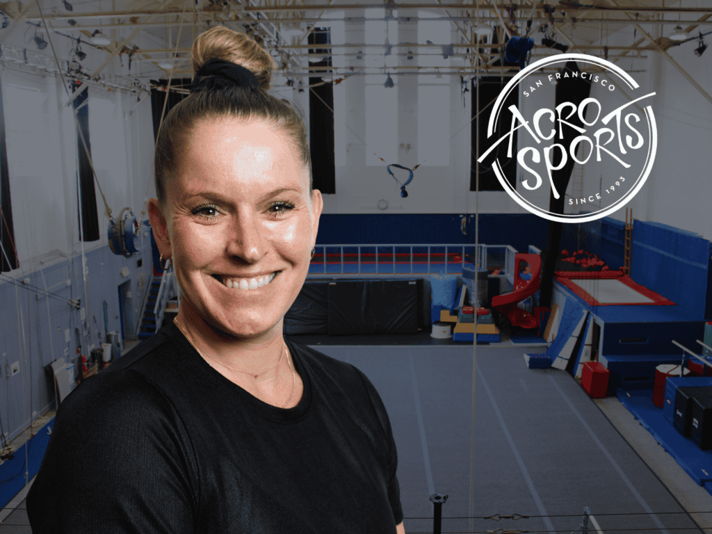 Tonya Paoli, AcroSports' new Executive Director, smiling in the gym