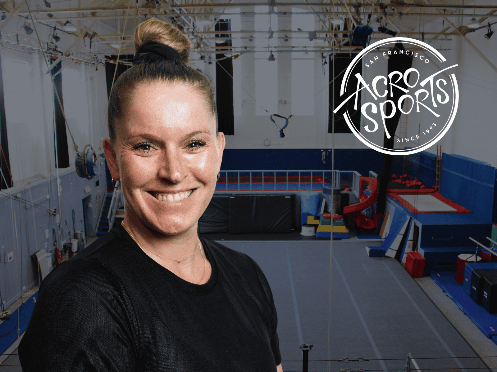 Tonya Paoli, AcroSports' new Executive Director, smiling in the gym